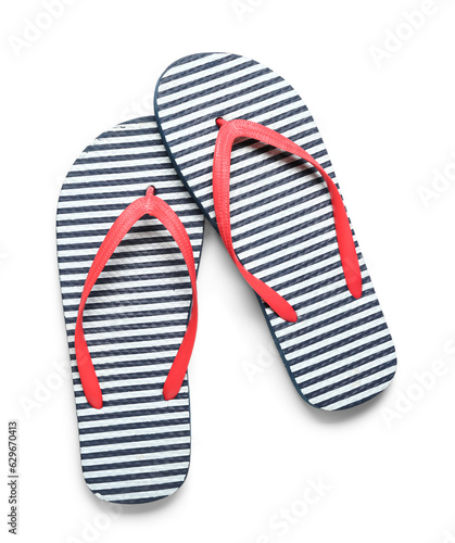 Pair of striped flip-flops on white background