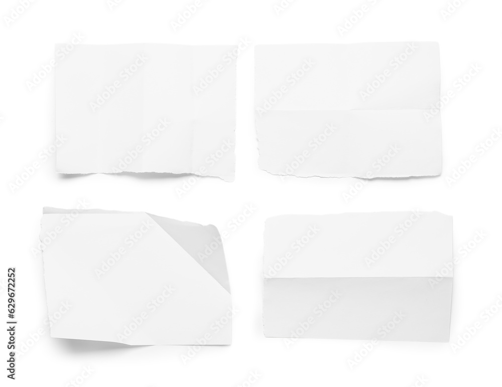 Pieces of creased paper sheets isolated on white background Pieces of creased paper sheets isolated on white background
