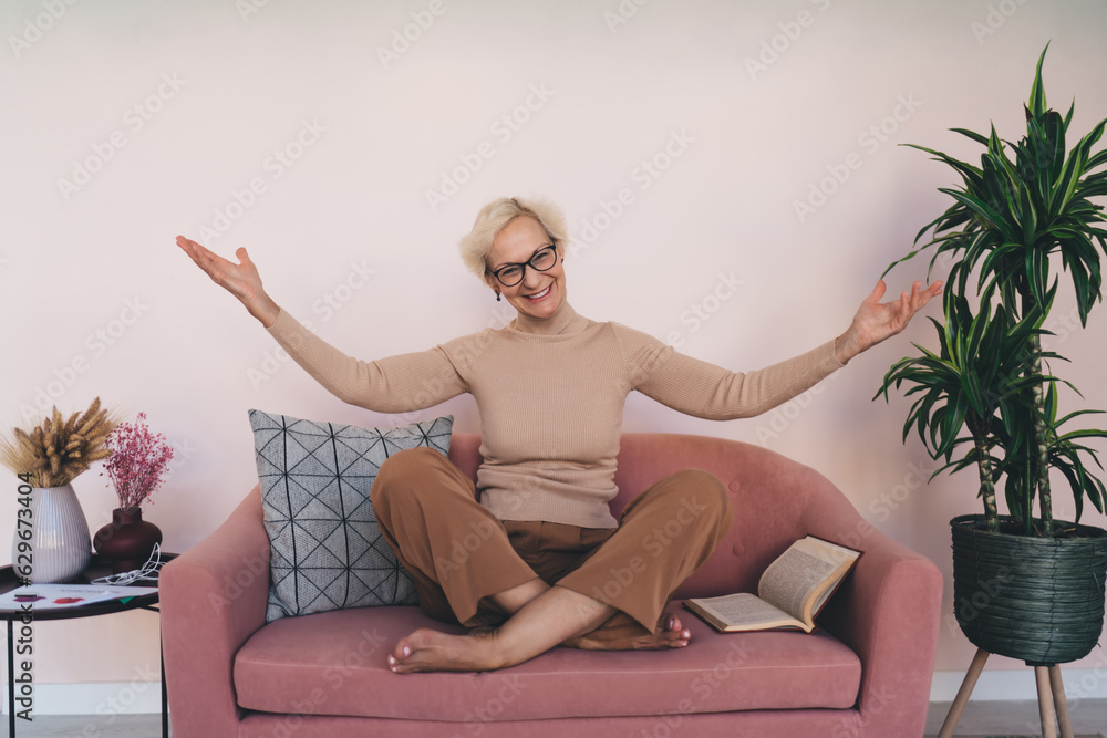 Mature woman resting on couch with legs crossed