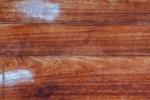 Wooden plank brown background with paint smears