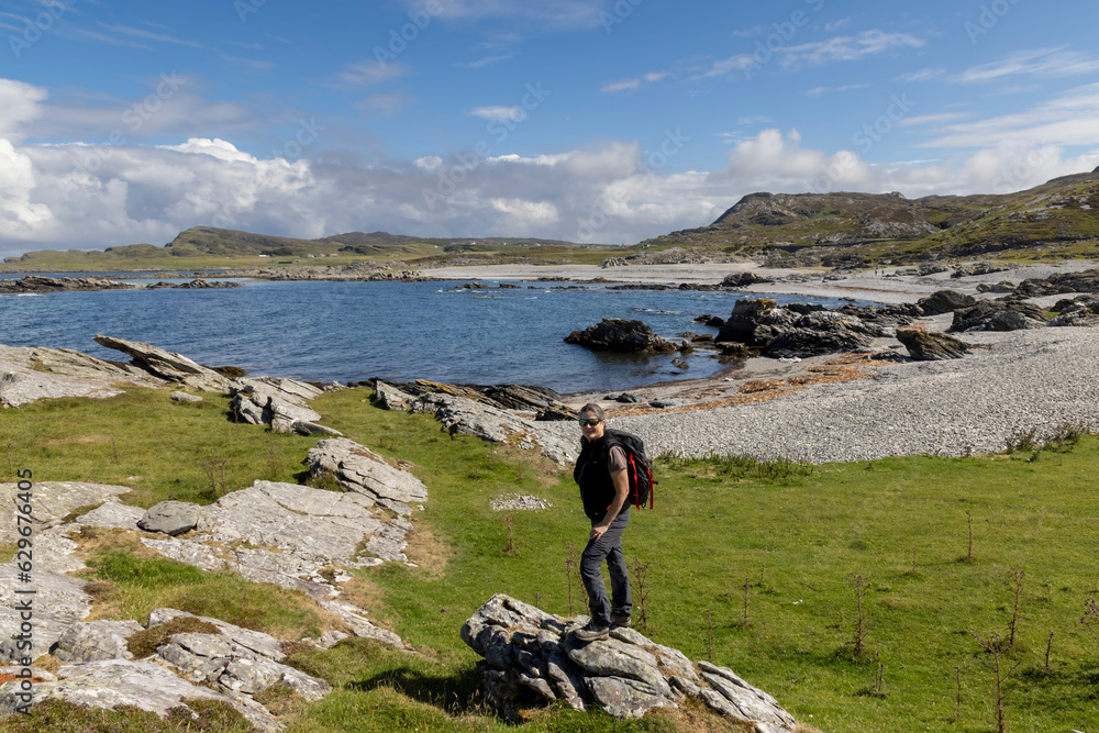woman hiking on the isle of Colonsay, Scotland