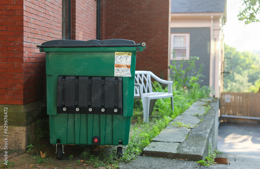 urban debris, a solitary trashcan stands as a symbol of waste, neglect, and our responsibility to preserve the environment urban debris, a solitary trashcan stands as a symbol of waste, neglect, and our responsibility to preserve the environment