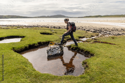 Obraz na płótnie woman hiking on the isle of Colonsay in Scotland w salonie