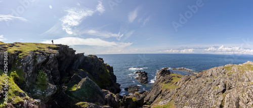 Obraz na płótnie panoramic shot of woman on the cliffs of Balnahard on isle of Colonsay, Scotland w salonie
