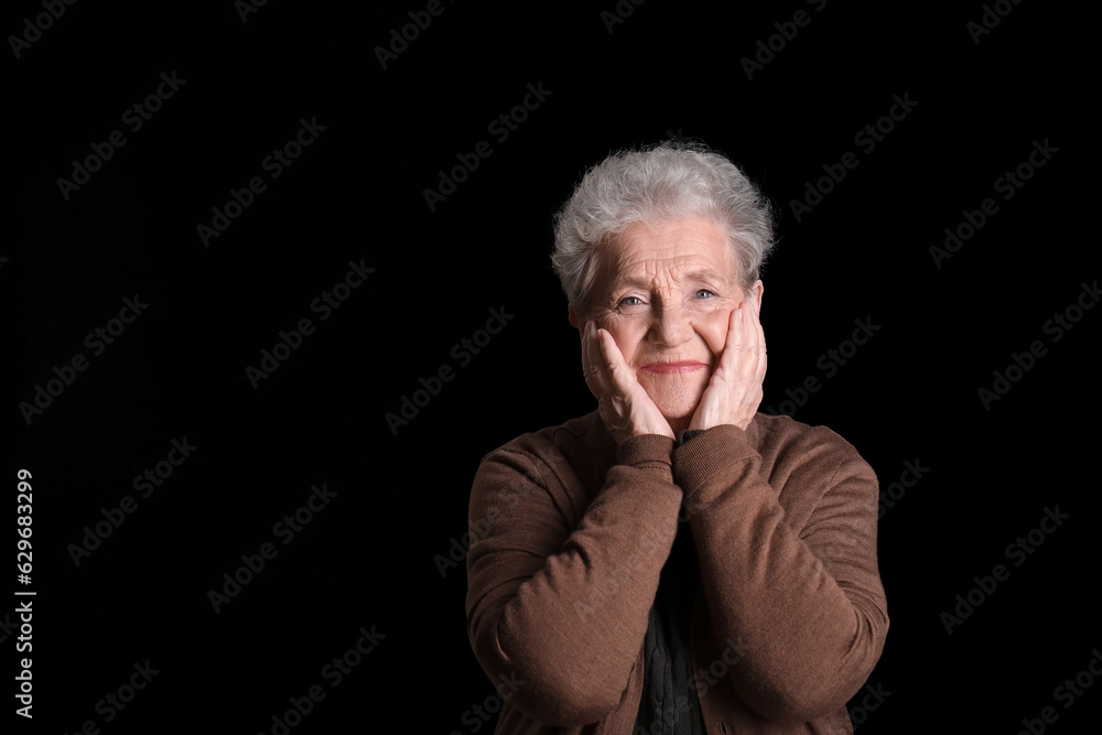 Senior woman on black background Senior woman on black background