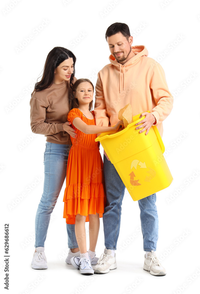 Little girl with her parents throwing paper garbage in recycle bin on white background Little girl with her parents throwing paper garbage in recycle bin on white background