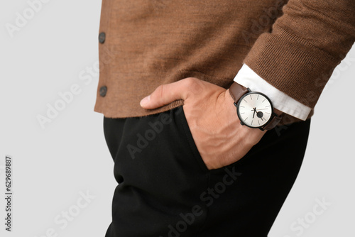 Stylish young man with wris...