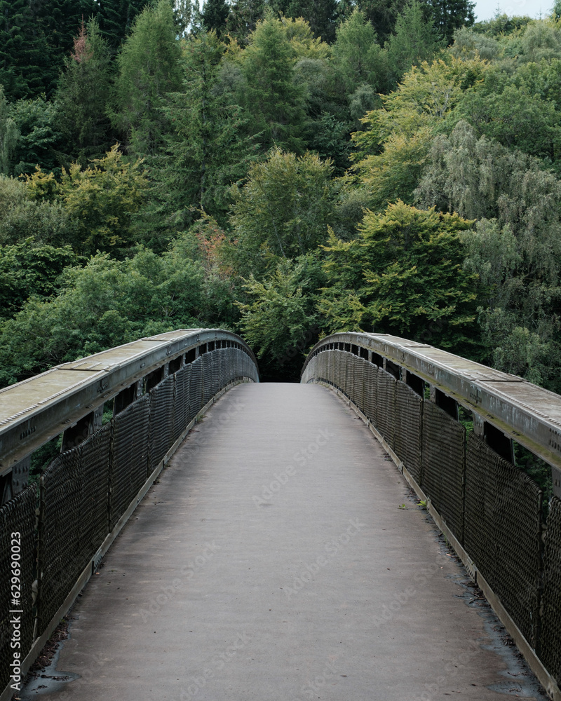 Footbridge into the woods in Pitlochry, Scotland