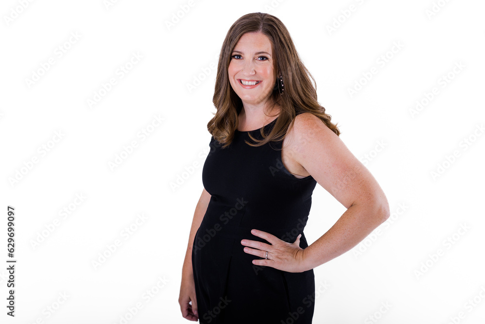 Confident business woman in black jumpsuit against white background Confident business woman in black jumpsuit against white background
