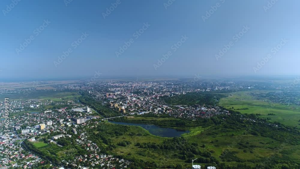 Aerial view of Ukraine. A modern Ukrainian city with a river and a large part of nature with a park. Panorama. Aerial view of Ukraine. A modern Ukrainian city with a river and a large part of nature with a park. Panorama.