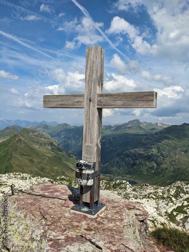 Summit cross on the Schwarzstöckli in the Sardona unesco area above Glarus. Wanderlust in Switzerland. High quality photo