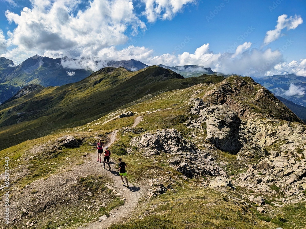 Trail running in the Swiss mountains. Run in a breathtaking environment. Trail run on narrow paths. Trailrun, running. High quality photo