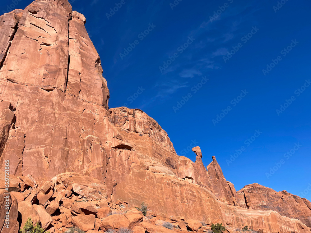 Moab, Utah, looking at the amazing rock formations created due to erosion from wind and water on the sandstone with Red Rock Cliffs carved by the Colorado River Moab, Utah, looking at the amazing rock formations created due to erosion from wind and water on the sandstone with Red Rock Cliffs carved by the Colorado River