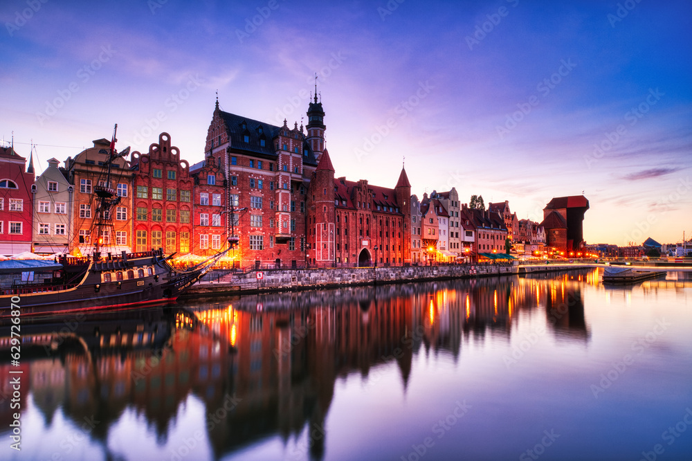 Illuminated Gdansk Old Town with Calm Motlawa River at Sunset, Poland
