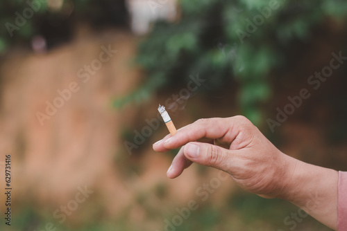 Hand holding cigarette