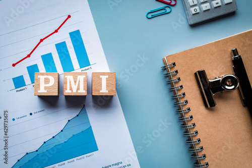 There is wood cube with the word PMI. It is an abbreviation for Post Merger Integration as eye-catching image. photo