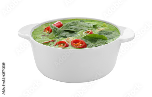 Saucepan of delicious green curry soup with chicken isolated on white