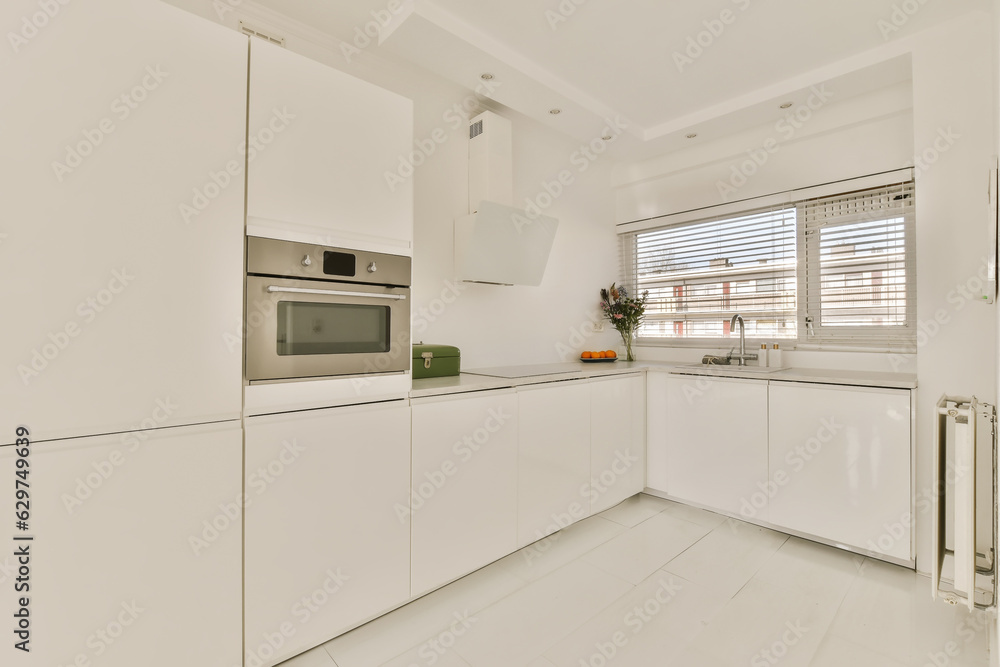 a kitchen with white cupboards and appliances on the counter top in an apartment development, melbourne, vic, australia a kitchen with white cupboards and appliances on the counter top in an apartment development, melbourne, vic, australia