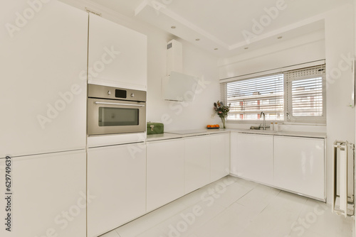 a kitchen with white cupboards and appliances on the counter top in an apartment development, melbourne, vic, australia