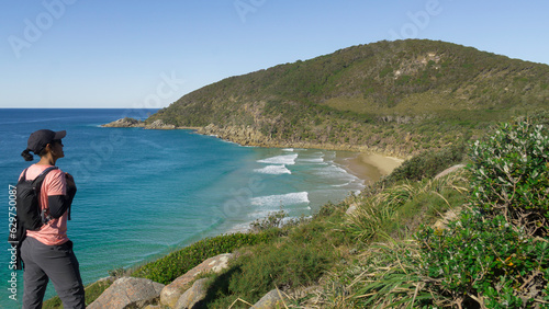 Female hiker looking to the Coast and Sea 