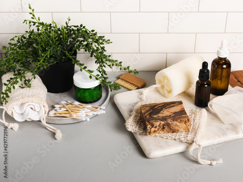 Handmade organic bar soaps on white tile background