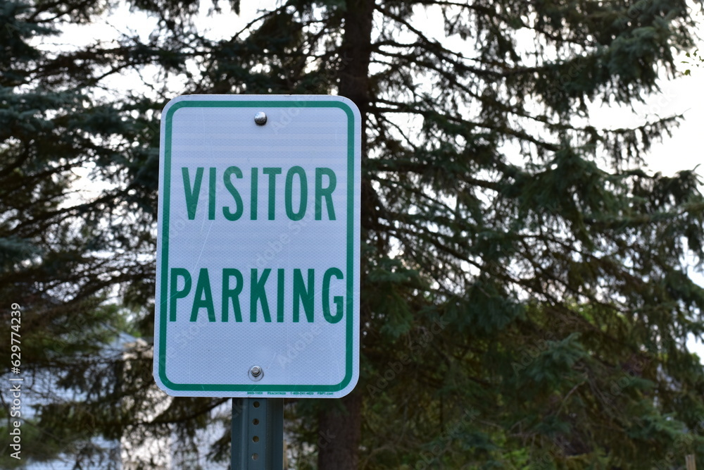 Visitor Parking Sign, Green and White, with Tree Background in Wisconsin