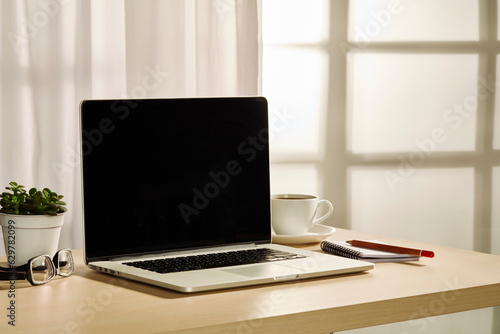 Wallpaper Mural laptop  on working table Torontodigital.ca