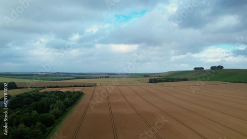 Cut throat razor crop circle design hidden on Hackpen hill farmland 2023, rising aerial view over Swindon countryside photo