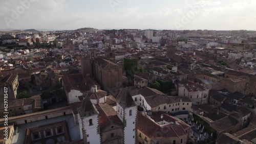 Cinematic aerial of historic city center, low angle. Caceres, Spain photo