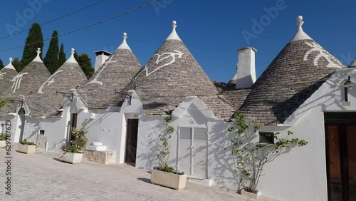 Alberobello Italy - traditional trulli houses with conical stone roofs. Famous landmark, travel destination and tourist attraction near Bari in Puglia, Europe.