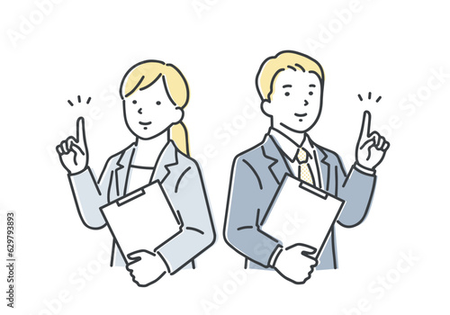 笑顔で指差しポーズをするビジネスパーソン／男女