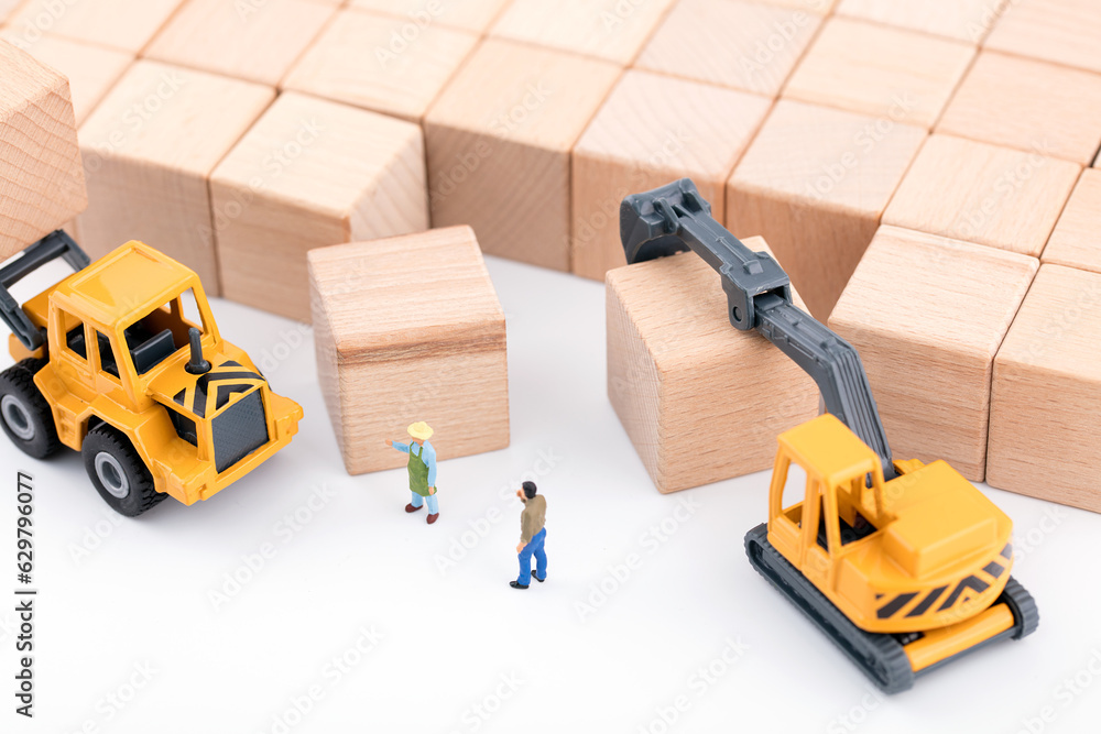 Obraz premium Miniature World Mechanical Handling of Wood Blocks