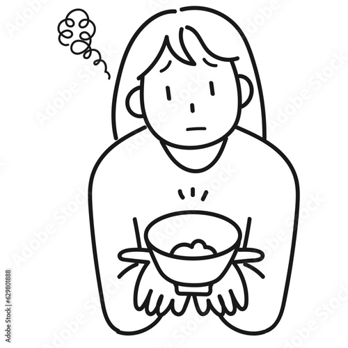 ダイエットのためにご飯を減らして不満顔の若い女性