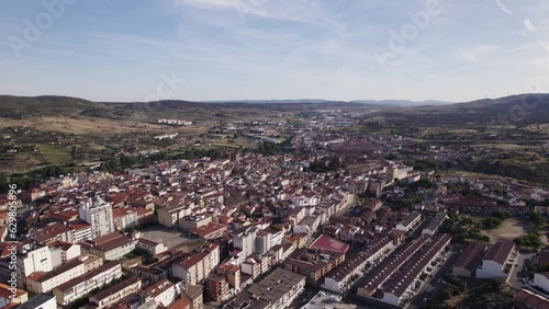 City skyline of Plasencia in Spain, drone orbit on a sunny summer day, copypsace photo