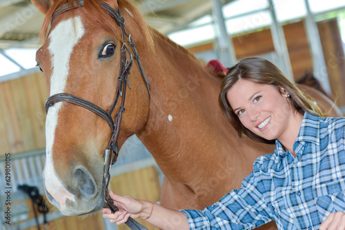 a happy woman with horse photo