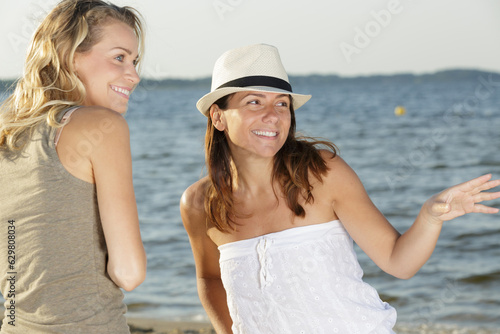 two happy women on beach