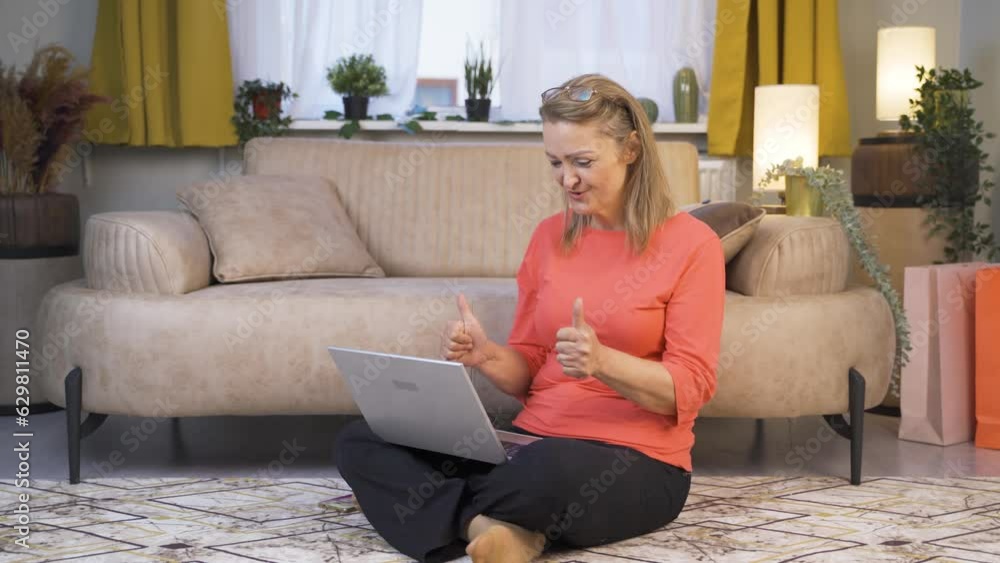 The woman who likes the application on the laptop is happy. The woman who likes the application on the laptop is happy.
