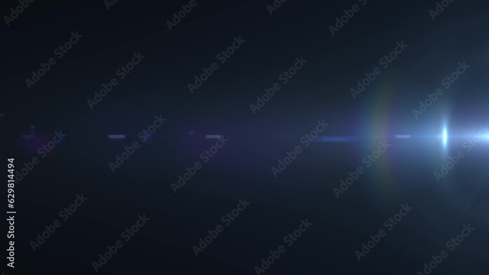 Optical lens flare on dark background, streaks and circles of lights moving horizontally from right side of the screen, reflection of light within the lens elements concept. Optical lens flare on dark background, streaks and circles of lights moving horizontally from right side of the screen, reflection of light within the lens elements concept.