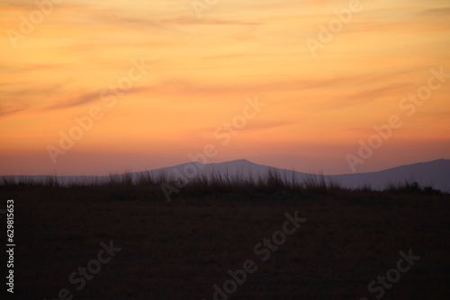 Red sunset and mountains silhouette