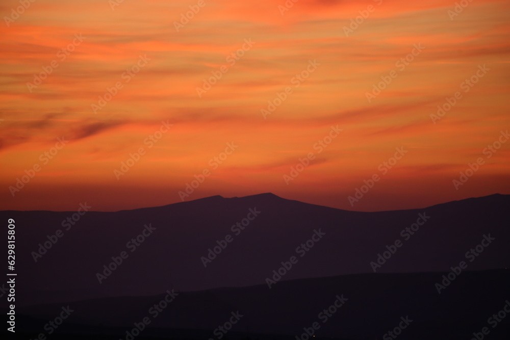 Red sunset and mountains silhouette