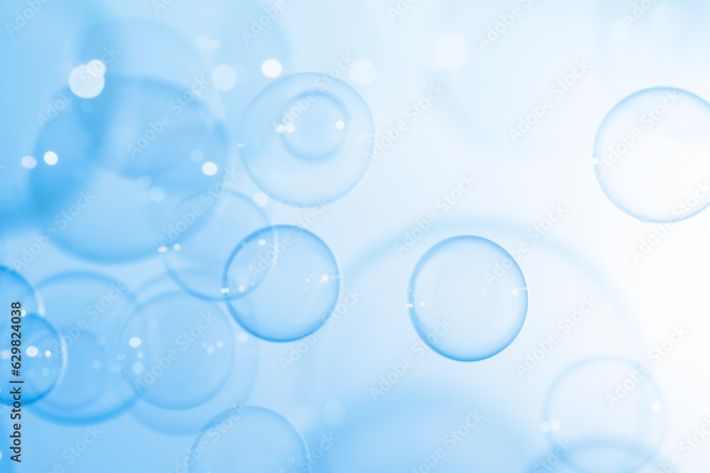 Refreshing of Soap Suds, Bubbles Water. Beautiful Transparent Blue Soap Bubbles Floating in The Air. Abstract Background, Blue Gradient Blurred Textured.