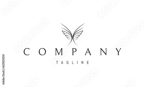 Vector logo on which an abstract image of a butterfly composed of two writing feathers.