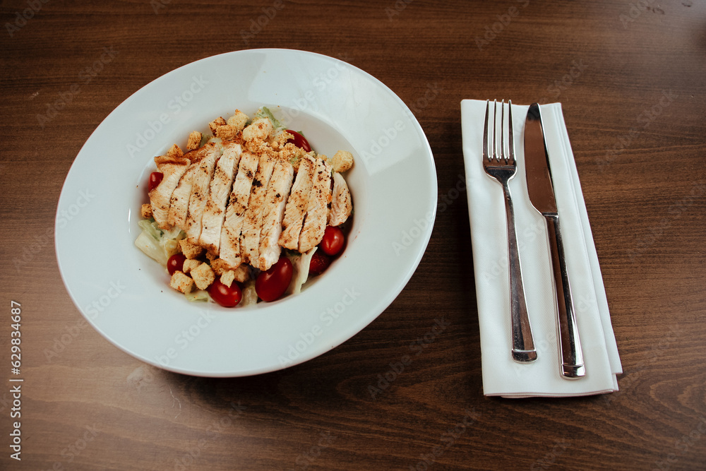 Chicken salad in stylish and luxurious restaurant Chicken salad in stylish and luxurious restaurant