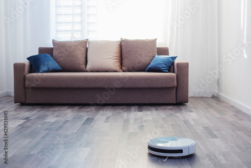 robot vacuum cleaner on the floor in living room