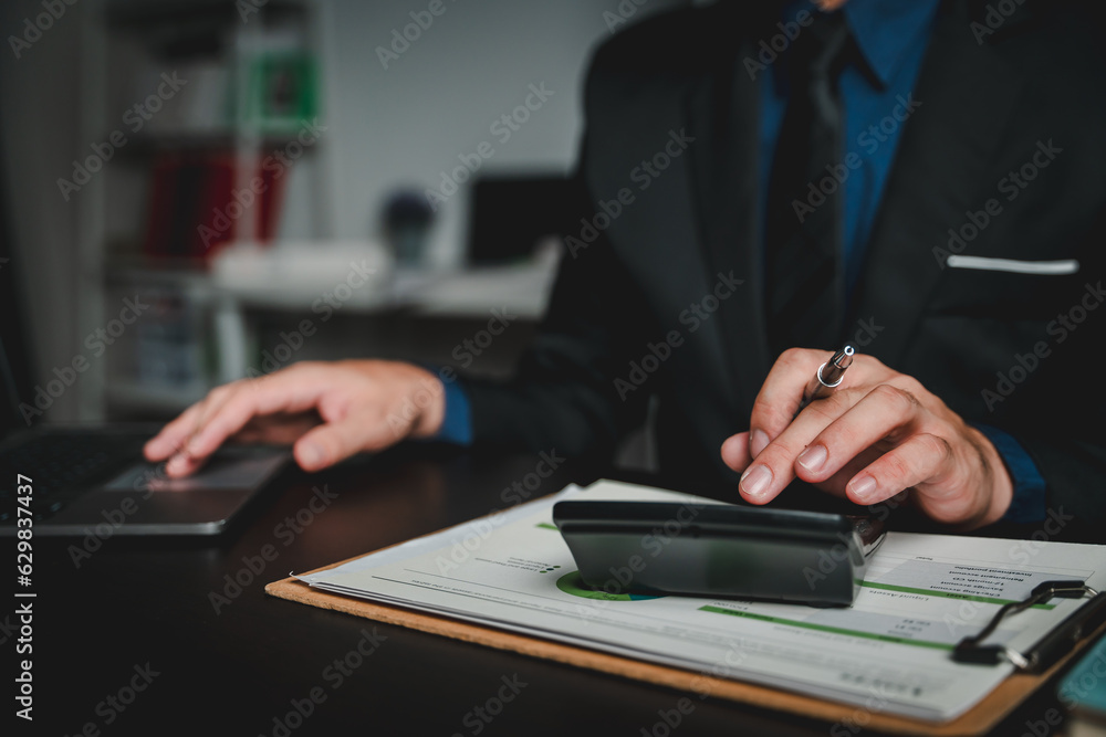 Portrait of man working on tablet computer in modern office make account analysis report Real estate investment information, financial and tax system concept Portrait of man working on tablet computer in modern office make account analysis report Real estate investment information, financial and tax system concept