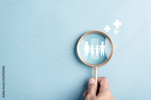 Magnifier focus to Protection family with plus sign icon, life and insurance concept. Family life insurance and policy.