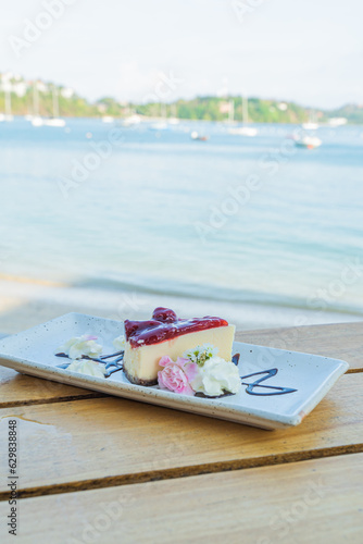 Appetizing white blueberry cake in a cafe next to the sea, Sue Flamingo, Ao Yon Beach, Phuket Thailand