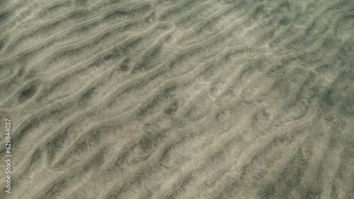 Sandy bottom covered with sand hills   Natural background from the underwater depth  Red sea  Egypt