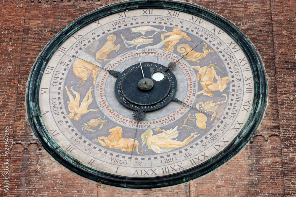 Clock on the Medieval Bell Tower of Cremona known as the Torrazzo, Lombardy, Italy.