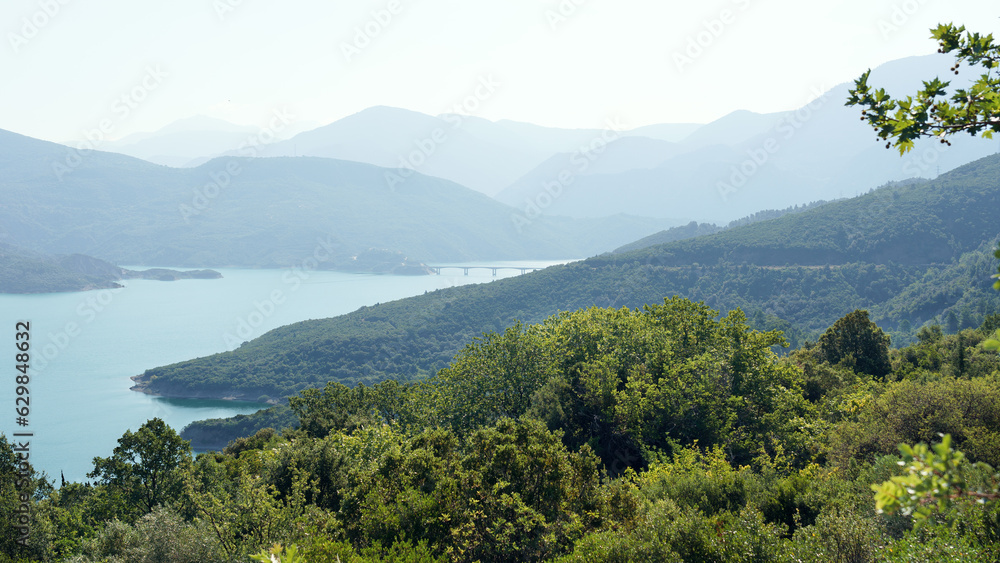 Picturesque landscape view of lake and mountains in Central Greece, Evrytania region. Lake Kremaston. Picturesque landscape view of lake and mountains in Central Greece, Evrytania region. Lake Kremaston.